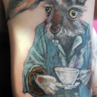 Large color-ink March hare tattoo on upper arm
