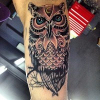 Large cool mens colorful owl tattoo on forearm