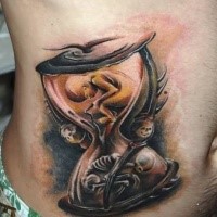 Life and death hourglass tattoo on side