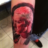 Lifelike colored arm tattoo of famous musician portrait