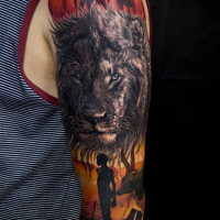 Lion and africa theme tattoo on arm