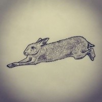 Little grey-ink hare frozen in motion tattoo design