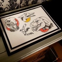 Lovely unolored dinosaur head with colored flowers tattoo design