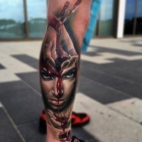 New school style bloody leg tattoo of woman face with bloody hands