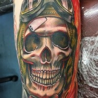 New school style colored biceps tattoo of smiling pilot skull in helmet