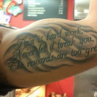 Nice black-lettered three-line quote on waves tattoo on arm