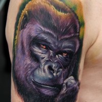 Nice realistic colorful gorilla muzzle tattoo on upper arm