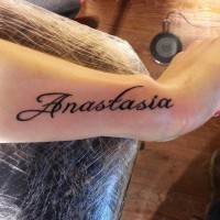 Nice simple girl name quote tattoo on arm