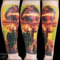 Nuclear explotions with man and dog tattoo on forearm