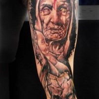Old art like colored upper arm tattoo of old woman with little child