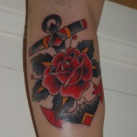 Old school anchor with red rose tatoo on shoulder