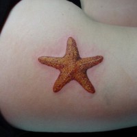 Orange starfish tattoo for girls on thigh
