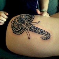 Polynesian style big black and white animal elephant tattoo on thigh