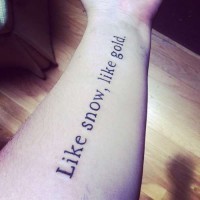 Printed like snow, like gold quote tattoo on arm