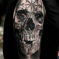 Realism style skull with sacred symbols tattoo by Neon Judas