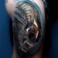 Realistic Alien tattoo on thigh