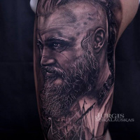 Realistic Ragnar wikings tattoo on shoulder
