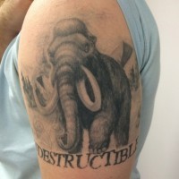 Realistic black-and-white mammoth woth quote tattoo on upper arm