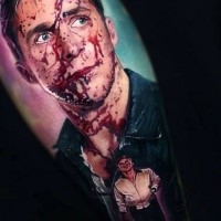 Realistic painted colored arm tattoo of bloody man portrait