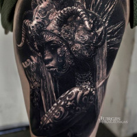 Realistic woman in hamlet tattoo on thigh