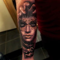 Realistic woman in mask and origami tattoo