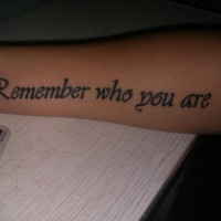 Remember who you are quote tattoo on arm