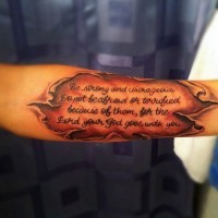 Ripped skin quote tattoo on arm