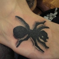 Scary black-ink ant tattoo on foot