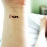 Simple I am quote tattoo on arm