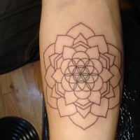 Simple black-contour flower of life tattoo on arm