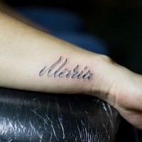 Simple romantic name quote tattoo on arm