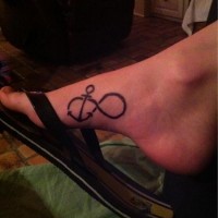 Small black anchor infinity tattoo on foot