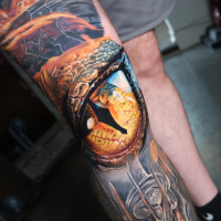 Smaug’s eye right on the knee tattoo