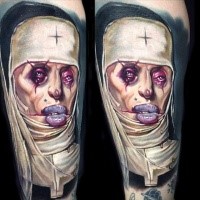 Strange looking colored tattoo of monster woman