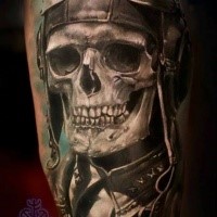 Stunning realistic painted thigh tattoo of old pilot skull with helmet