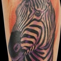Super violet-colored zebra head on orange background tattoo