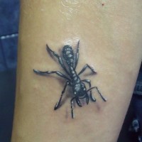 Tiny black-and-white ant tattoo on left arm