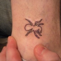 Tiny cute black-contour ant tattoo on arm