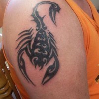 Tribal scorpion tattoo for men on upper arm