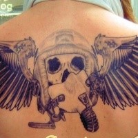 Unfininshed pilot dedicated upper back tatto of skull with mask and wings