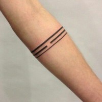 Unusual lined black-ink band tattoo on forearm