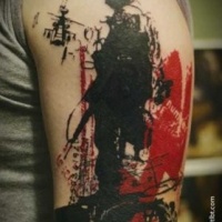Unusual trash polka style colored upper arm tattoo of modern soldier with lettering