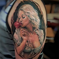 Vintage portrait like colored upper arm tattoo of sexy girl with kandy