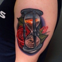 Vivid colors hourglass with roses tattoo