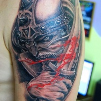 Warrior and blooded sword tattoo on shoulder