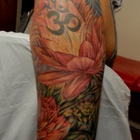 Wonderful japanese flowers with sign tattoo on upper arm