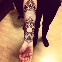 Wonderful ornamented tattoo on forearm