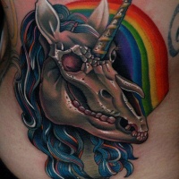 Zombie like colored unicorn animal skull tattoo on back