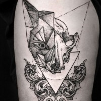 Abstract geometrical style black ink half fox half skull tattoo on thigh