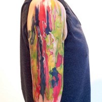 Abstract style big multicolored tattoo on shoulder length